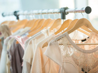 Dresses on a wooden hangers