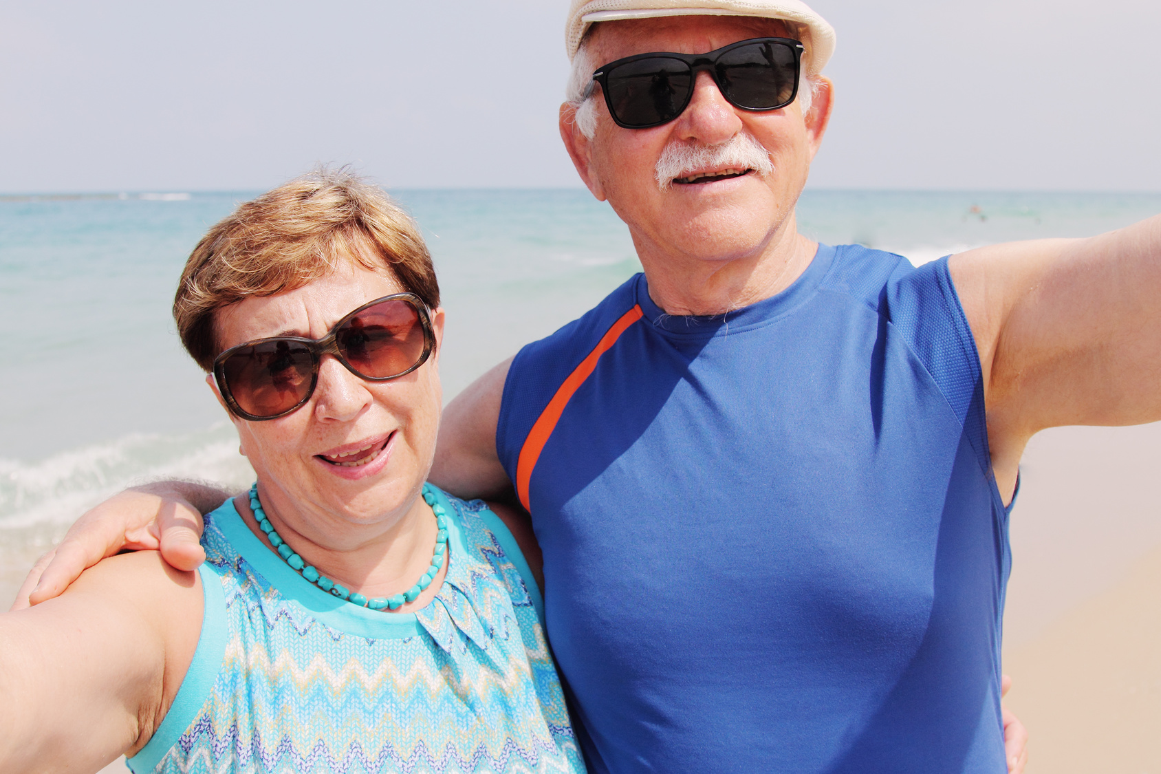 Selfie portrait of senior couple on the beach