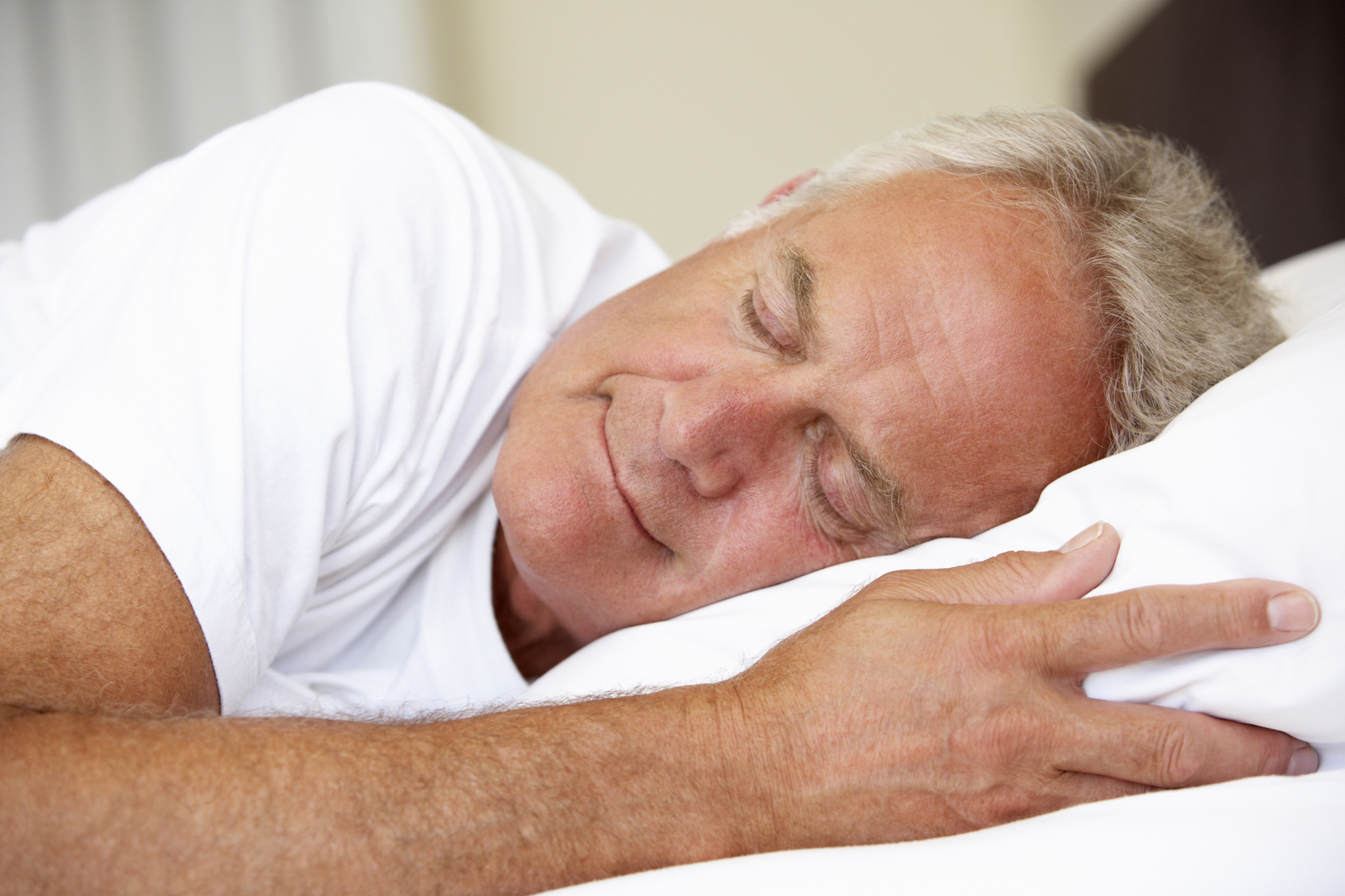 Senior Man Asleep In Bed