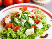 39731100 - healthy food, tomatoes and salad leaves with cheese and diet bread